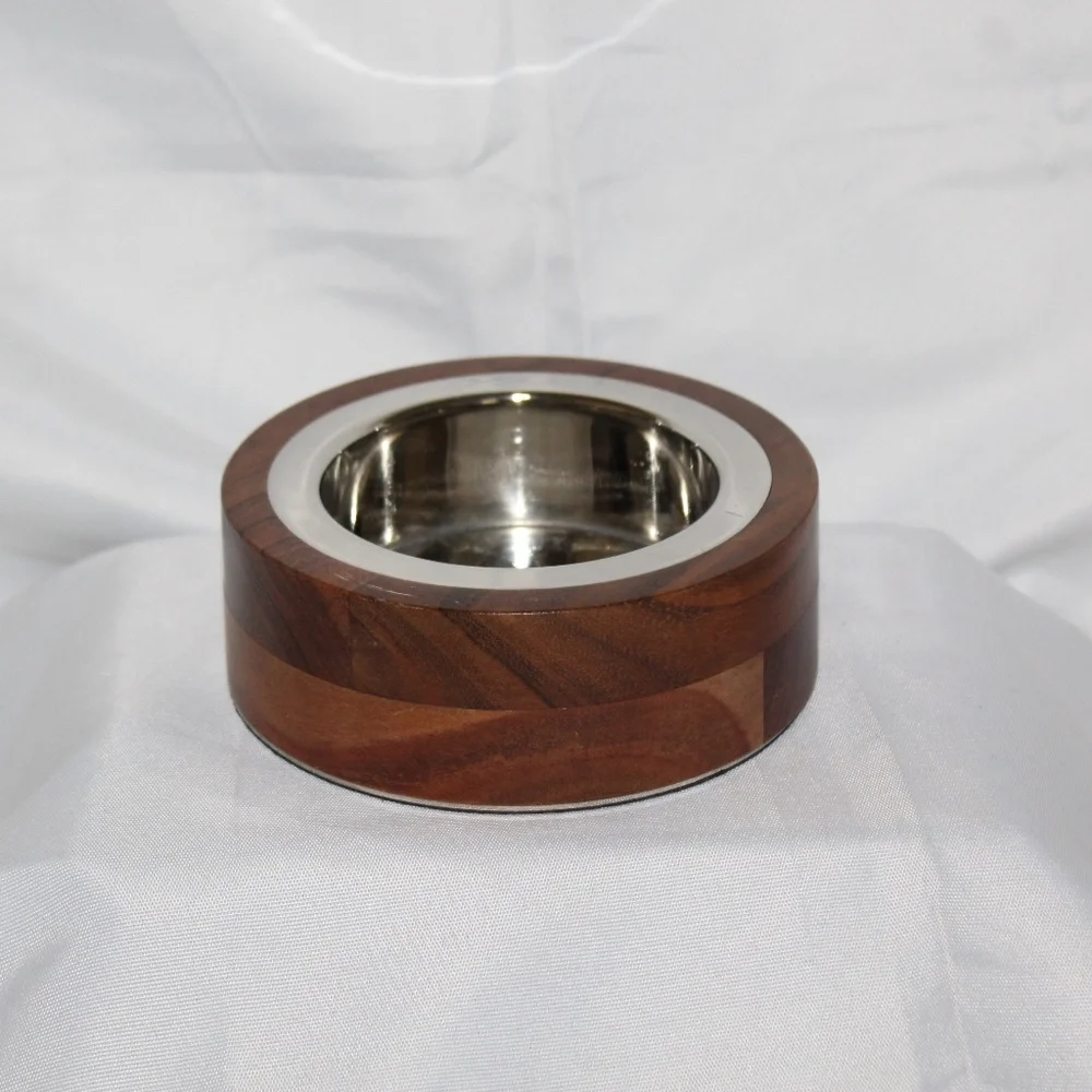 West Elm solid acacia wood bowl with metal alloy bowl in a Silver finish.